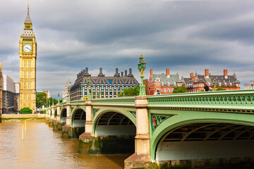 Fototapeta premium Big Ben clocktower and the Westminster Bridge leading to it across River Thames, London, United Kingdom.