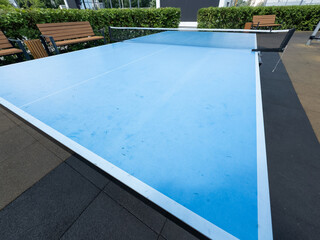 Concrete ping-pong table. Outdoor sports ground. Modern urban public space.