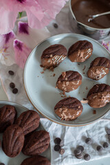 Homemade Chocolate Madeleines on dark table