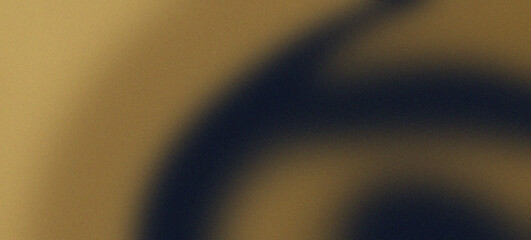 A mesmerizing navy blue and gold wave, gracefully crashing against a grainy background, creating a stunning visual contrast