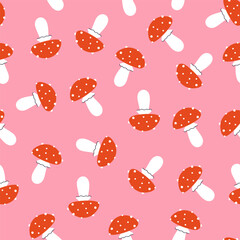 Simple seamless pattern with cute fly agarics. Vector graphics.