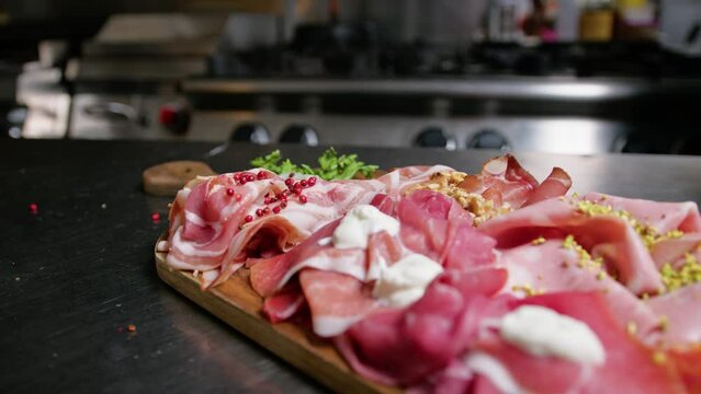 Chef Preparing Raw Ham And Mortadella Appetizer