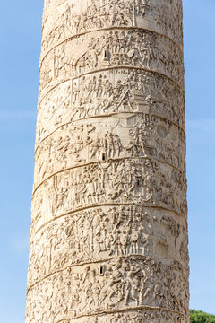 Rome, Italy - April 11, 2024: View of the trajan's column in Rome with tourists crowding its surroundings in Rome, Italy