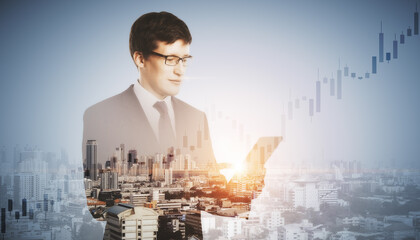 Attractive young european man with cellphone standing on blurry city background with mock up place...