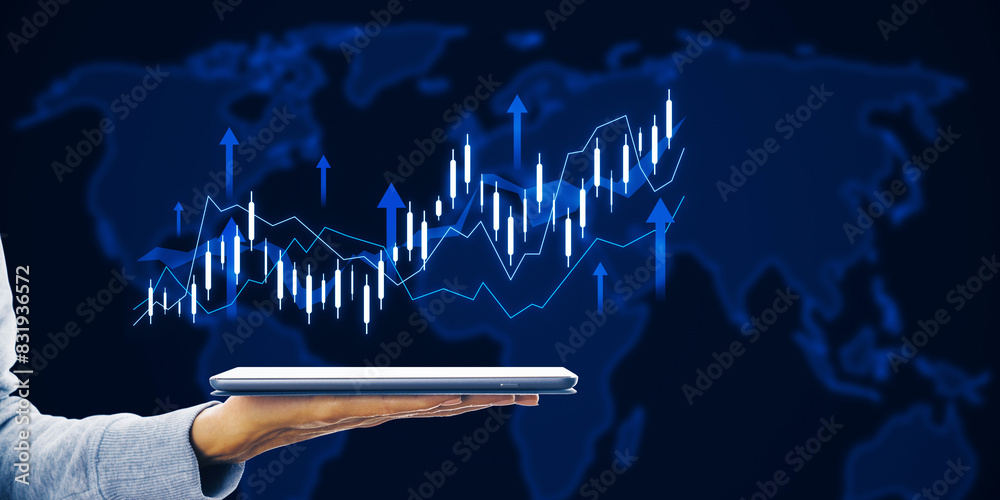 Poster close up of female hand holding tablet with growing forex chart with arrow and map on dark backgroun