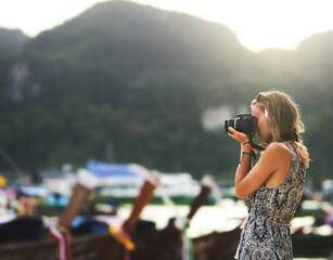 Camera, photographer and woman at beach on vacation, travel or summer holiday in Thailand in...