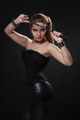 young vampire woman dressed in latex