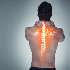 Man, back and spine pain in studio, injury and wellness or healthcare problem or massage neck for...