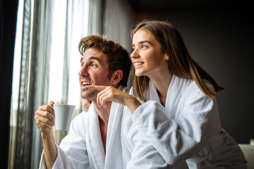 Beautiful young couple enjoying and relaxing in SPA center. People enjoying weekend, holiday