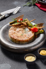 Savory aspic with rye crisps, pickles, mustard, and horseradish, a rich symphony of textures and tastes