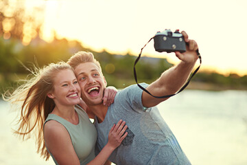 Couple, camera and happy outdoor with selfie for love, bonding and support with fun in California....