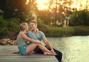 Couple, people and happy on dock in lake for love, bonding and support with care and fun in California. Relationship, vacation and smile for summer holiday, trip and adventure with joy as soulmate