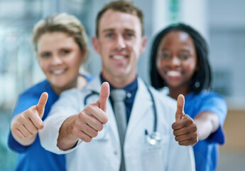 Portrait, teamwork and doctors in hospital, thumbs up and agreement with support, cooperation and...