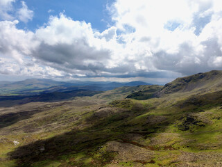 Fototapeta premium Beautiful landscape of rolling hills and valleys in Arenig Fawr, North Wales, Snowdonia