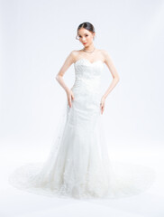 Fototapeta premium Asian young beautiful female portrait attractive model gorgeous charming bride wearing fashion wedding dress luxury perfect style, posing standing smile looking camera isolated white background studio