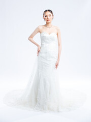 Fototapeta premium Asian young beautiful female portrait attractive model gorgeous charming bride wearing fashion wedding dress luxury perfect style, posing standing smile looking camera isolated white background studio