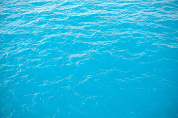 Beautiful texture of calm sea waves in the middle of the sea during the day. view from the boat of calm sea waves