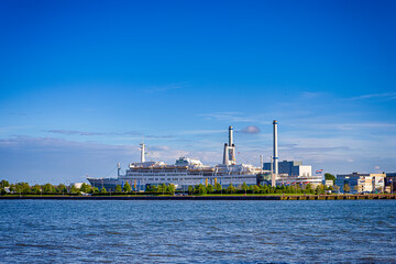 Obraz premium Holland Travel Destinations.Picturesque Cityscape View of Rotterdam Harbour and Port With Cruise Vessel in Background.