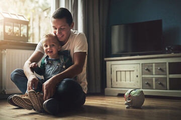 Family, man and child in living room for love, laugh and happiness in home together. Dad, young boy...