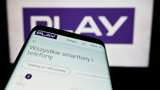 Stuttgart, Germany - 05-23-2024: Smartphone with website of Polish telecommunications company P4 sp. z o.o. (Play) in front of business logo. Focus on top-left of phone display.