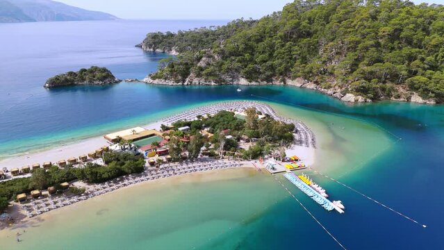 Fethiye, Oludeniz Kumburnu Beach Drone, Aegean Sea Islands Fethiye, Mugla Turkey. Mediterranean bays and beach blue water footage aerial green pine trees oludeniz blue lagoon