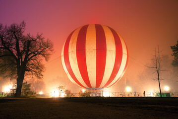 Hot air balloon on the ground in fog