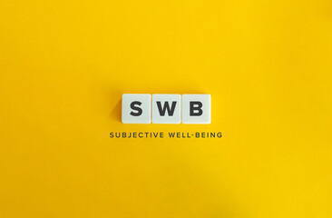 SWB, Subjective Well-being or Life Satisfaction. Text on Block Letter Tiles on Flat Background....