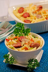 Macaroni with sausages and peppers.