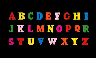 wooden letters of the English alphabet multi-colored on a black background