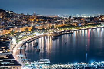 The city lights of Naples next to the harbor,