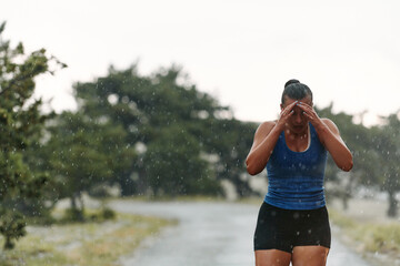 Unstoppable: A Determined Athlete Trains Through the Rain in Pursuit of Marathon Glory