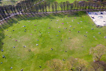 Aerial photo of members of the public enjoying the sunshine while obtaining social distancing rules...