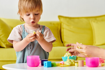 mother and her toddler daughter engage in Montessori play and learning at home, exploring toys together at a small table.