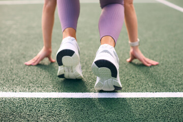 Fototapeta premium Close Up Of Female Athlete With Feet On Starting Line Before Start Of Race