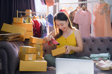 Young Business woman Packing and Taping Cardboard Box Small business owners Young Woman sending a package