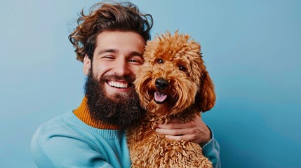 Happy man with his Golden Doodle, isolated against a light blue background