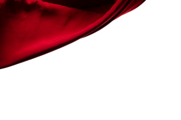 Red curtain fabric flying in curve shape, Piece of textile red curtain fabric throw fall in air. White background isolated, dark shading environment