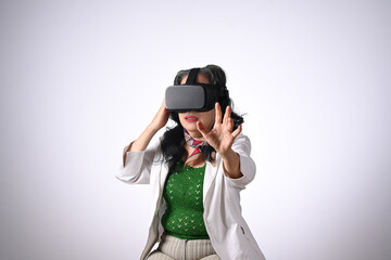 Excited senior woman VR headset enjoying virtual reality experience. Futuristic technology concept