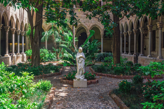 Jesus statue in the middle of a garden in Christian Church Basilica of the Immaculate Conception and Assumption of Our Lady (Basilica de la Purissima Concepcio), Barcelona, Catalonia, Spain