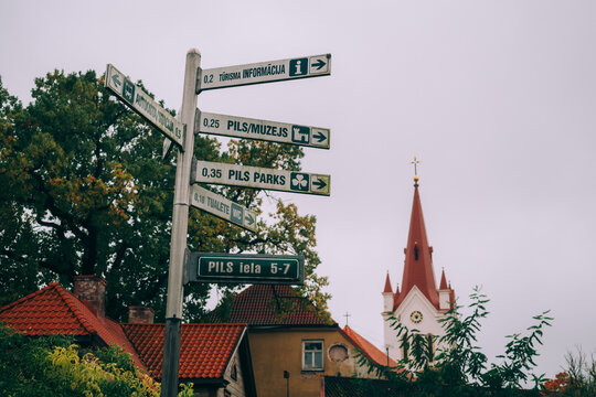 Signpost and St. John's Church in the Medieval Cesis Old Town, Cesis, Latvia, Baltics
