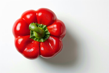 a red pepper on a white surface