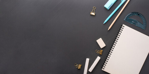 School supplies on black background. Back to school concept. Top view. Copy space.