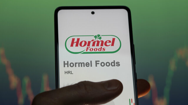 April 09th 2024 , Austin, Minnesota. Close up on logo of Hormel Foods on the screen of an exchange. Hormel Foods price stocks, $HRL on a device.