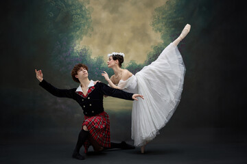 Ballerina in arabesque pose touching shoulder of her beloved partner. Dancers in scene of famous...