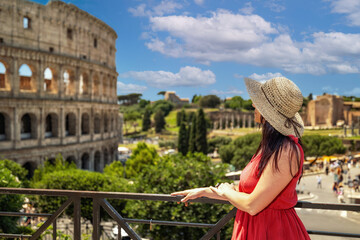 Fototapeta premium A girl on holiday in Rome visits the Colosseum.