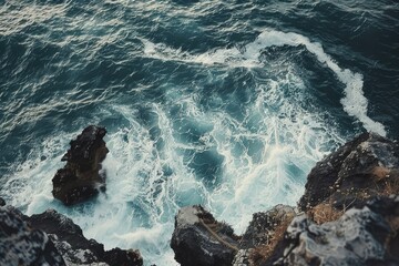 Rocky cliffs meeting crashing waves