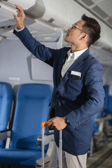 Airplane, travel and portrait of male with journey and backpack.