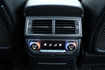 Car ventilation system for rears seats. Rear passenger air conditioning. Climate control for rear passengers. Conditioner dashboard display. Climate control dashboard.