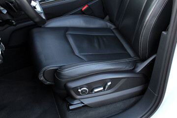 Driver seat of a new modern car. Leather car interior. Black leather drivers seat in a car. Front...