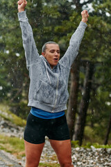 Beautiful Woman Enjoying Rainy Day After Intense Run